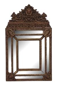 A Dutch Repousse Brass Cushion Mirror Height 51 x width 30 inches. — 19TH CENTURY