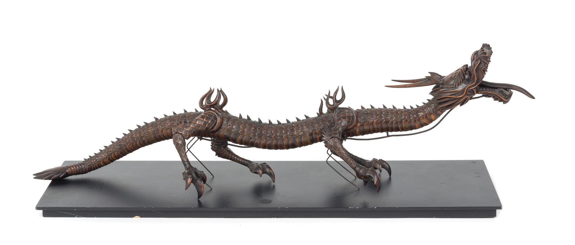 An Articulated Wood Figure of a Dragon Length 28 inches. — 19TH CENTUTY