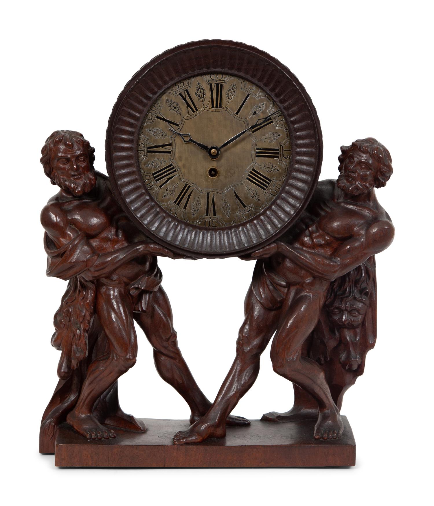 A Continental Carved Oak Figural Clock