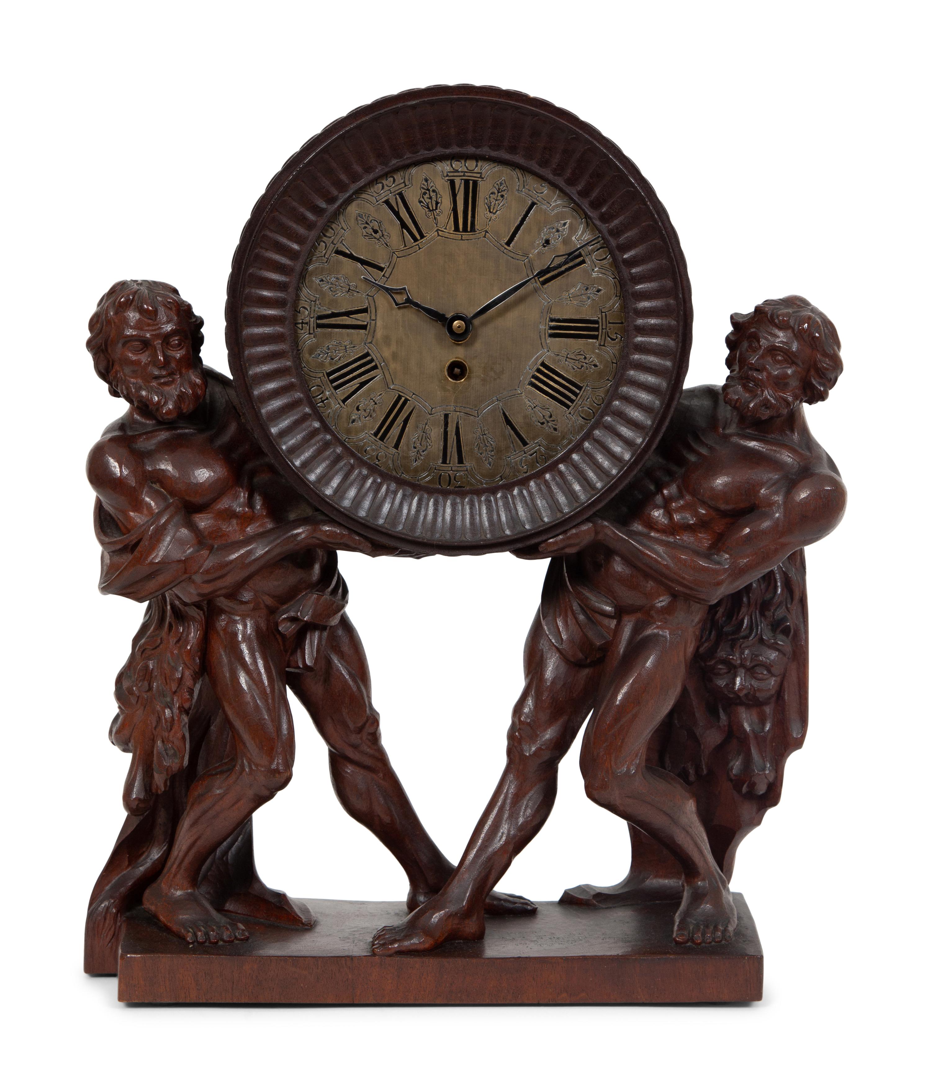 A Continental Carved Oak Figural Clock