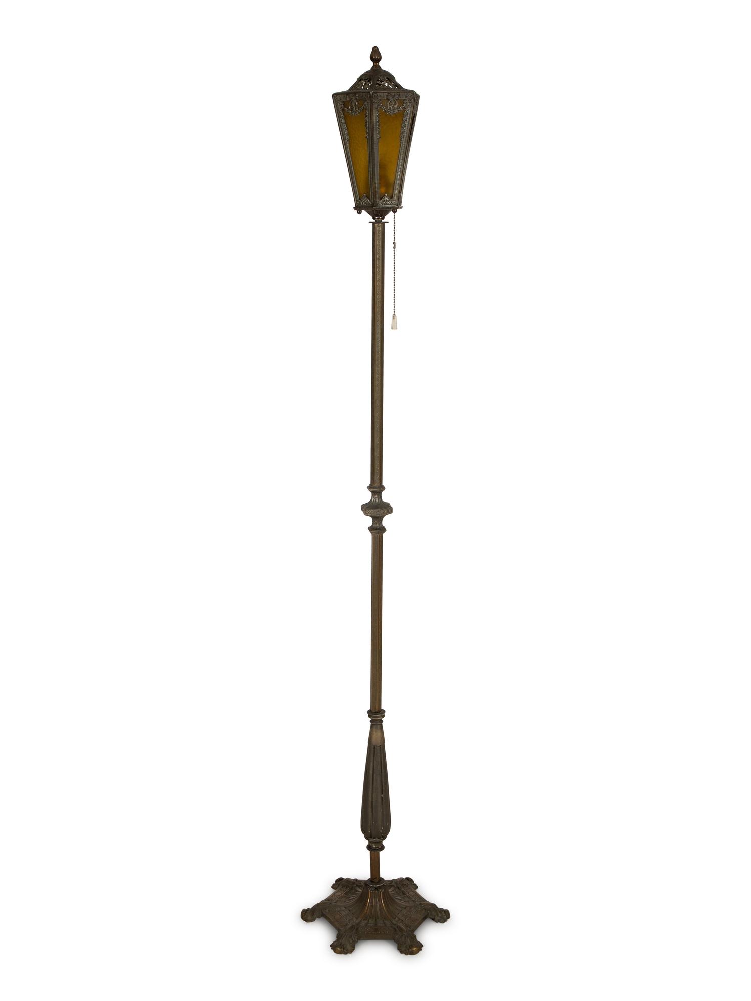 A Pair of Patinated Metal Lantern Style Floor Lamps