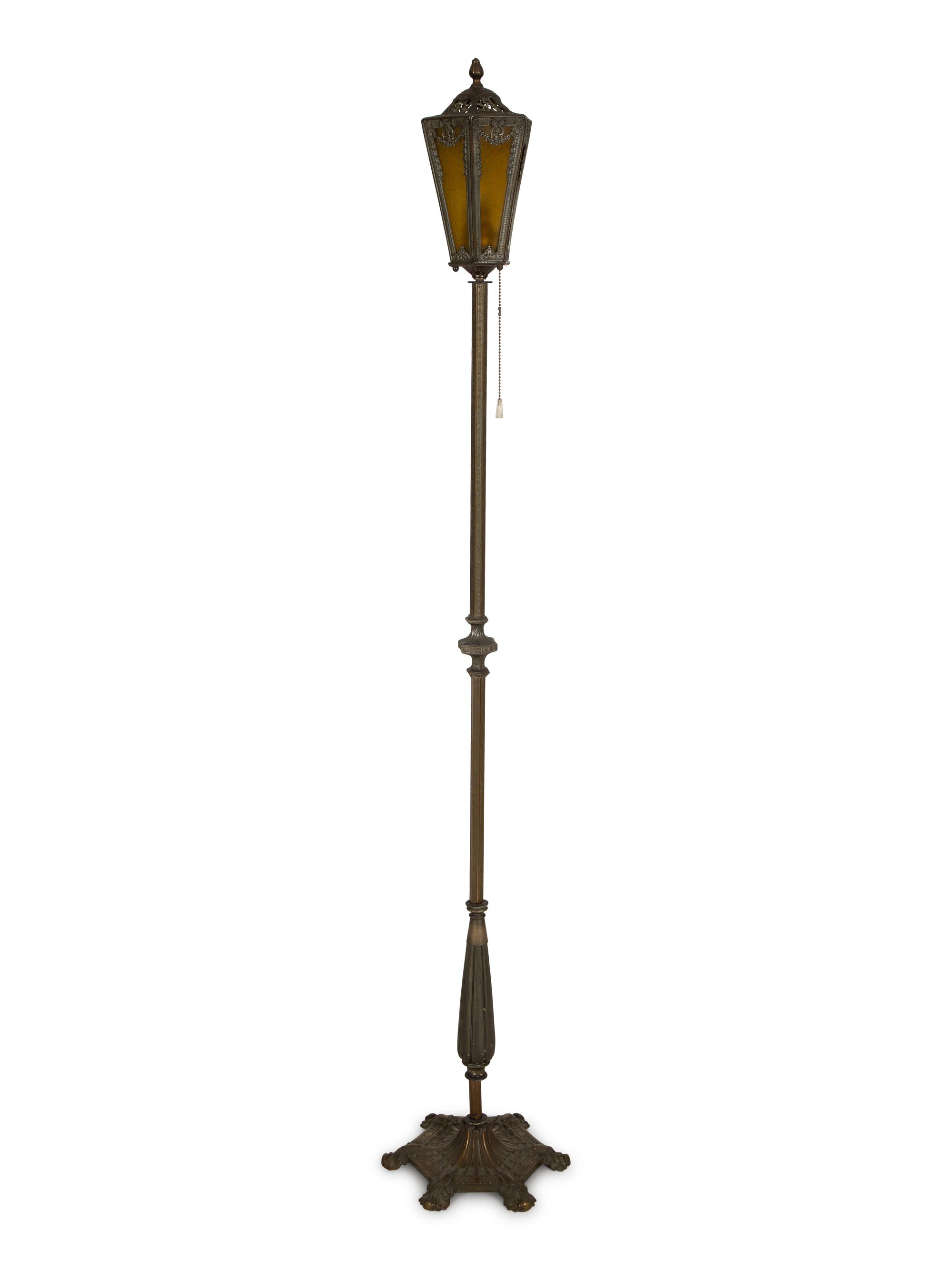 A Pair of Patinated Metal Lantern Style Floor Lamps