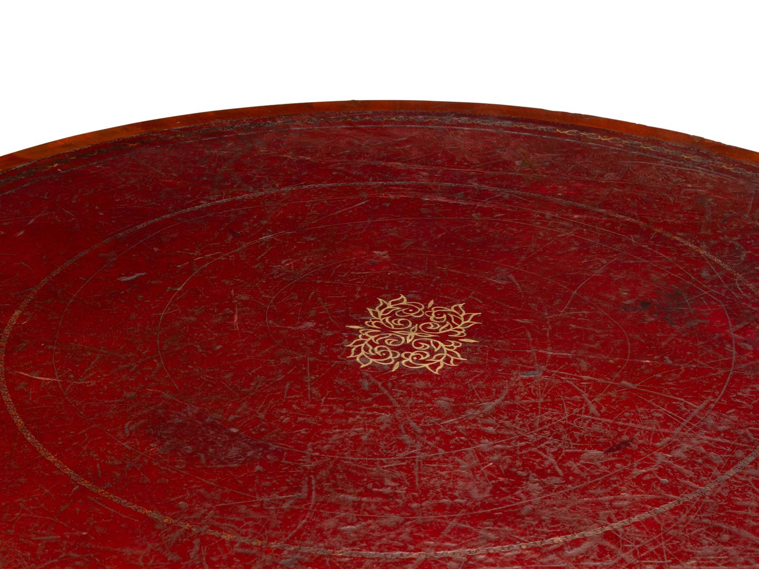 A Victorian Mahogany and Parcel Gilt "Rent" Table