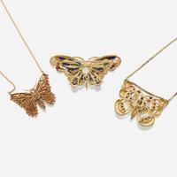 A collection of three pieces of gold and gem set jewelry