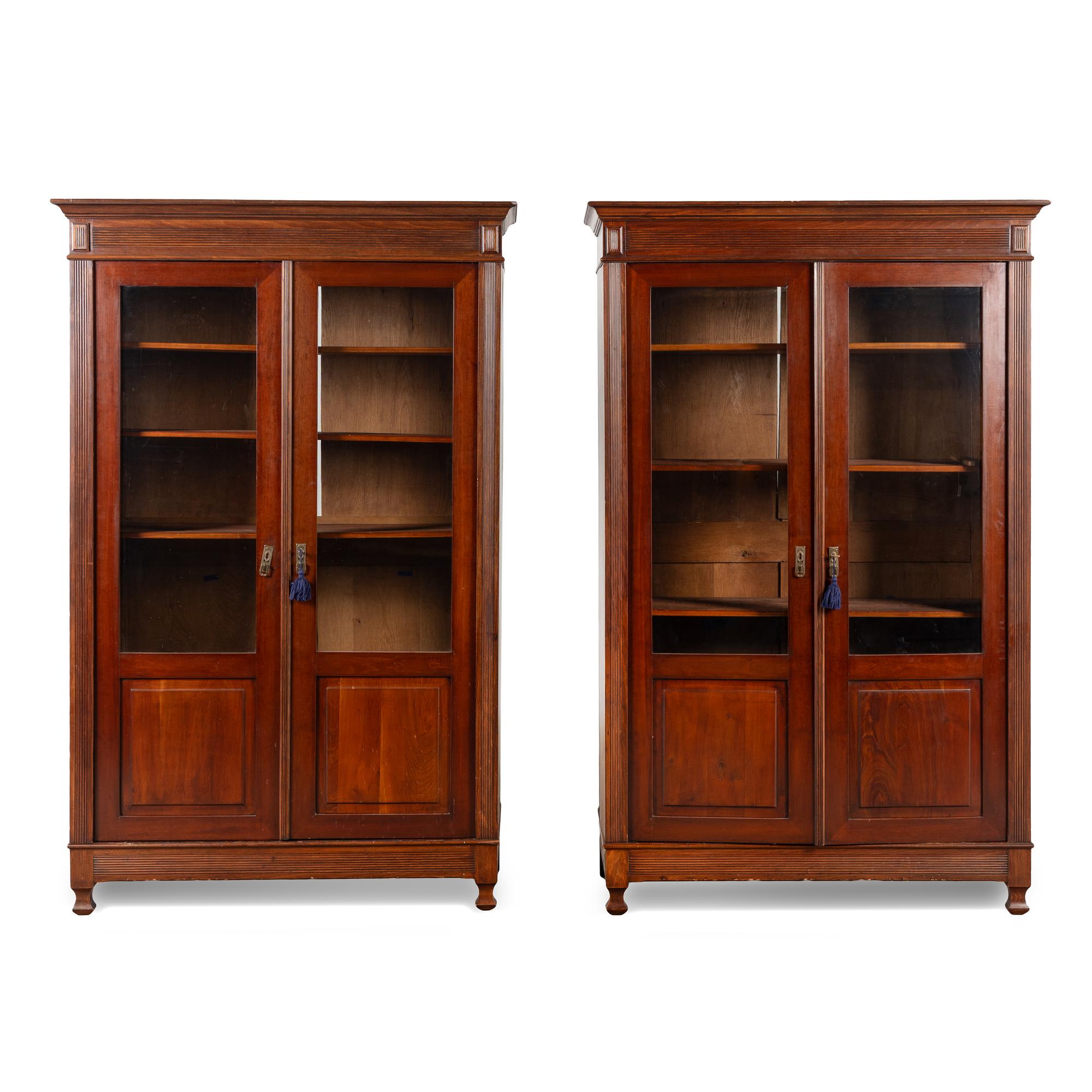 A Pair of English Mahogany Bookcase Cabinets