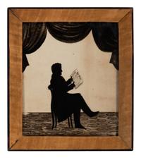 A Reverse Glass Painted Silhouette of a Gentleman Reading