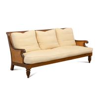 An Anglo-Colonial Style Teak and Cane Four-Piece Seating Suite