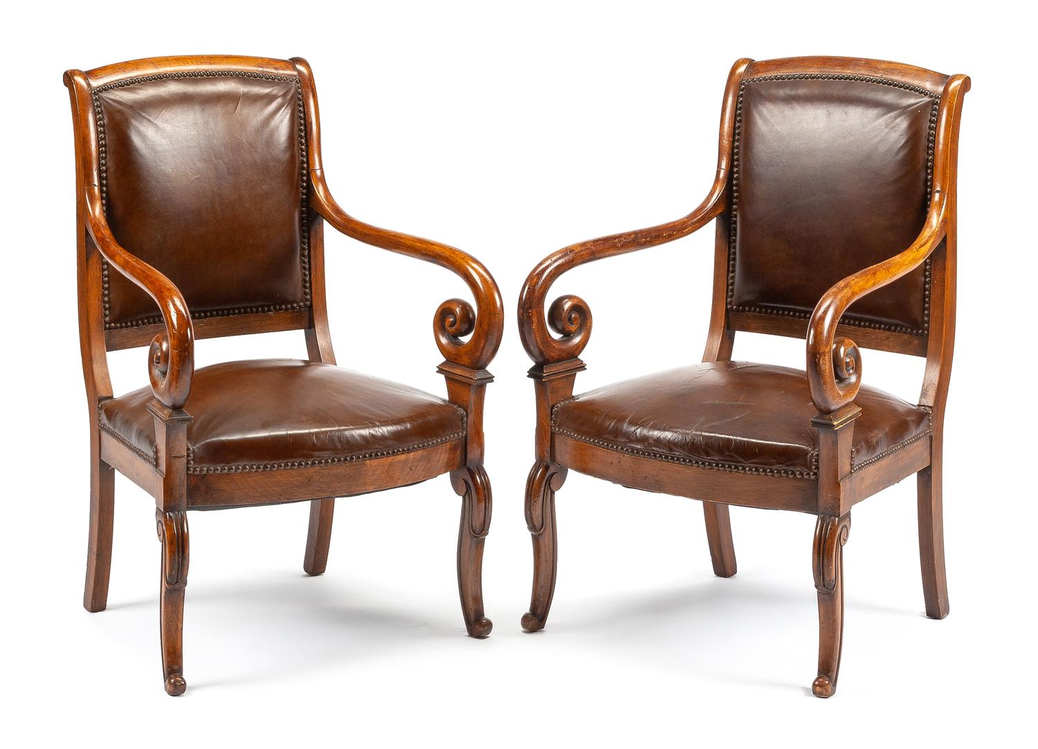 A Pair of Louis Philippe Walnut Fauteuils Height 34 3/4 inches. — 19TH CENTURY