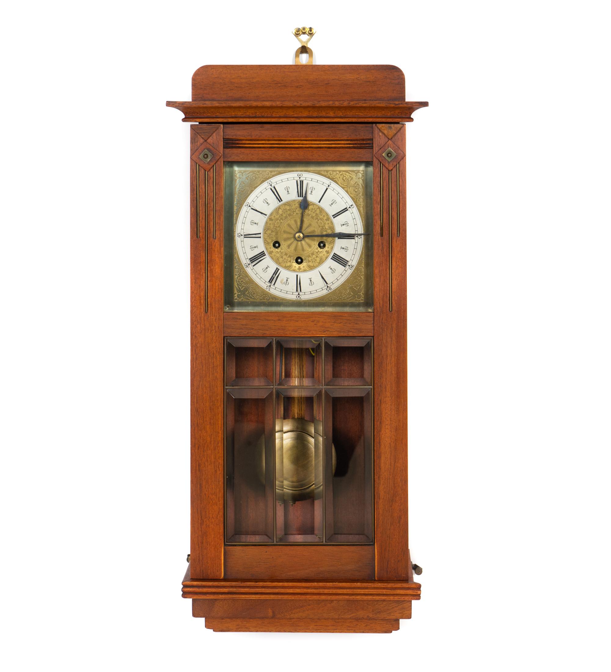 An Arts and Crafts Mahogany and Leaded Glass Wall Clock