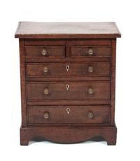 A Small Chest of Drawers Height 18 1/4 inches.