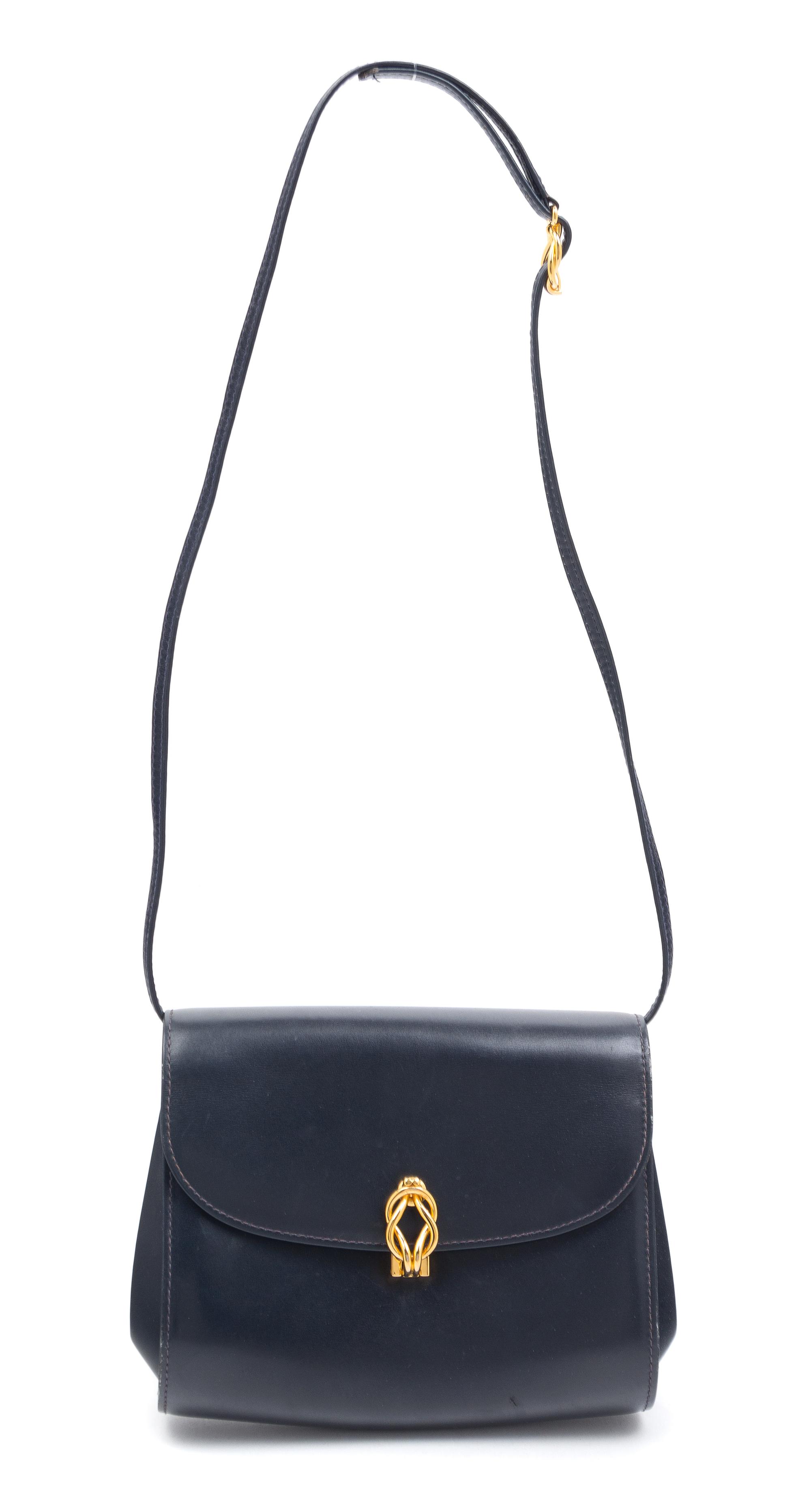 A Gucci Navy Handbag, 6.5" x 7.5" x 3".