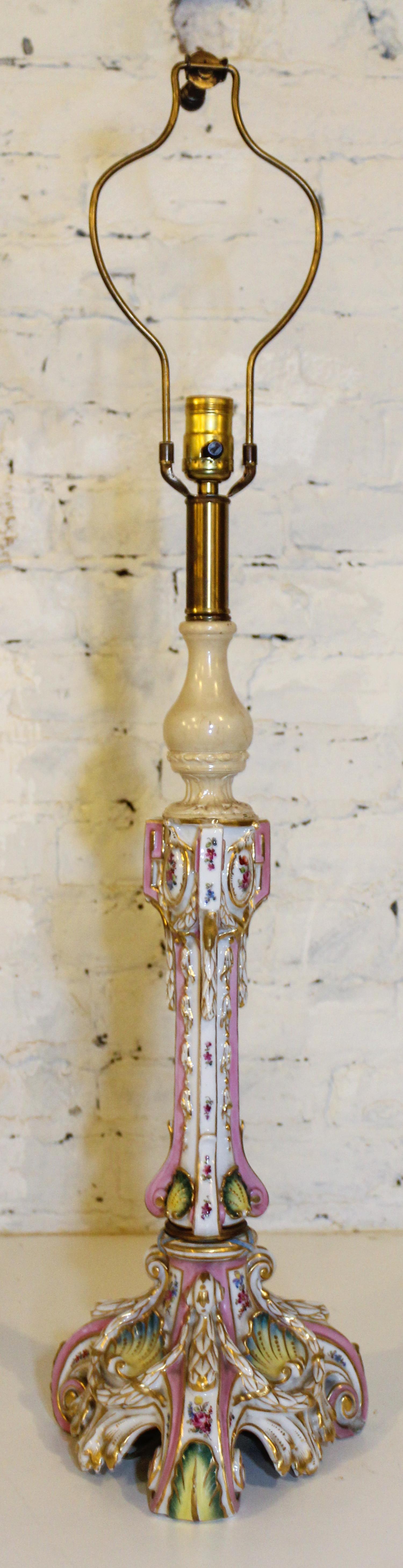 A German Porcelain Candlestick Mounted as a Lamp. Height of porcelain 17 3/4 inches.