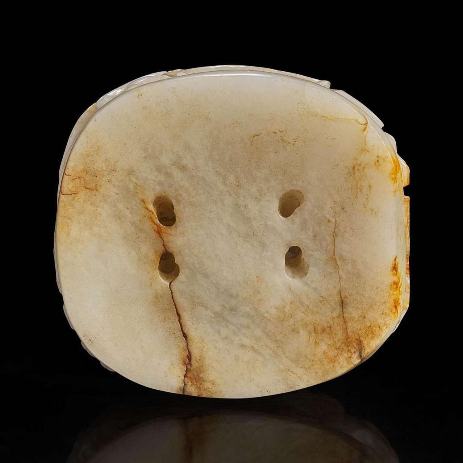 A Chinese reticulated white and russet jade finial 透雕玉炉端