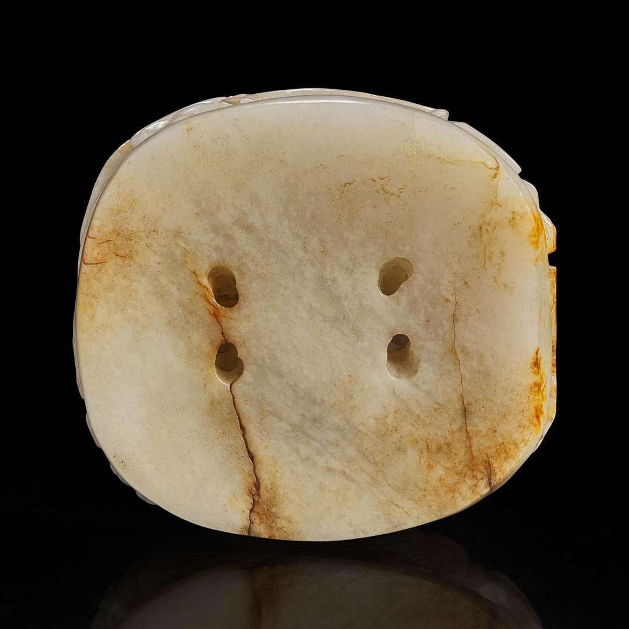 A Chinese reticulated white and russet jade finial 透雕玉炉端