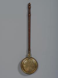 An English Engraved and Pierced Brass Bed Warmer