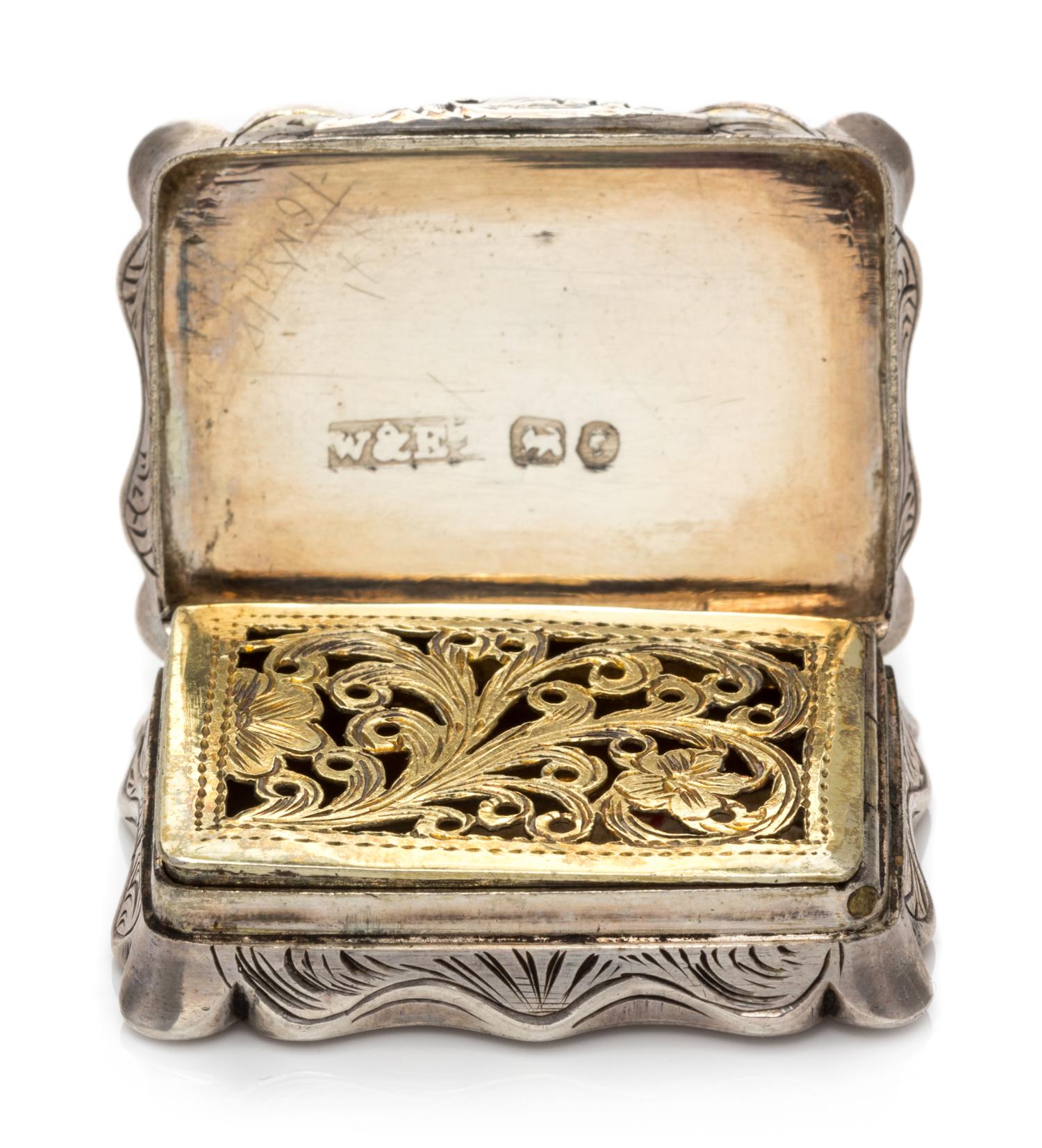 A Victorian Silver Vinaigrette, William & Edward Turnpenny, Birmingham, 1845, the case worked with foliate volute decoration, the lid c