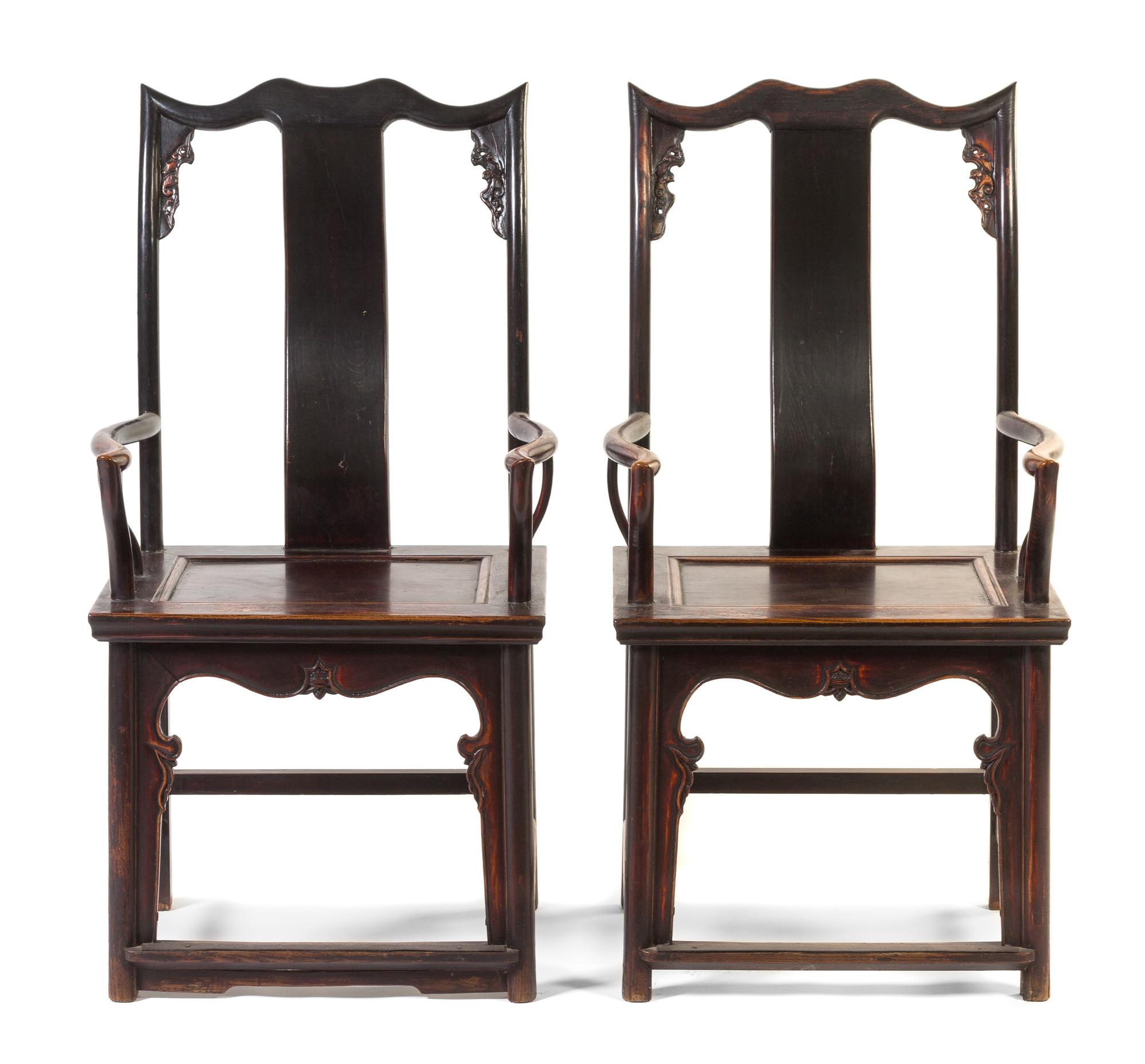 A Pair of Chinese Lacquered Elmwood Official's Hat Armchairs, Sichutouguanmaoyi Height 44 3/4 inches.