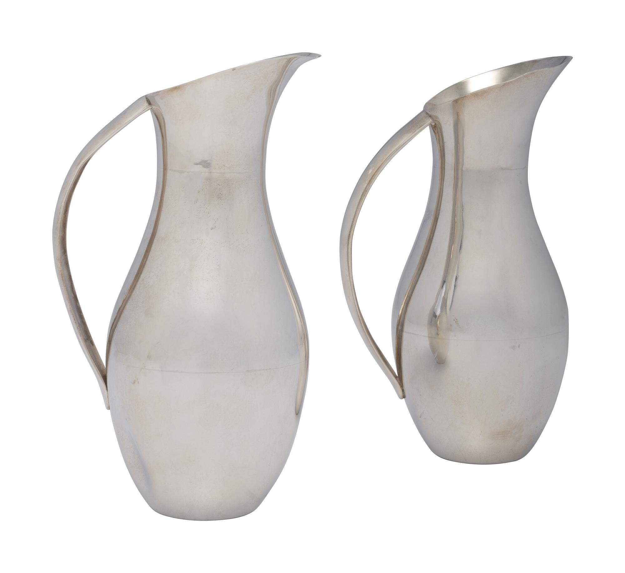 A Pair of Mexican Silver Pitchers