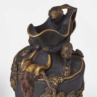 A Near Pair of Wedgwood Gilt and Bronzed Black Basalt Water and Wine Ewers UK, late 19th century