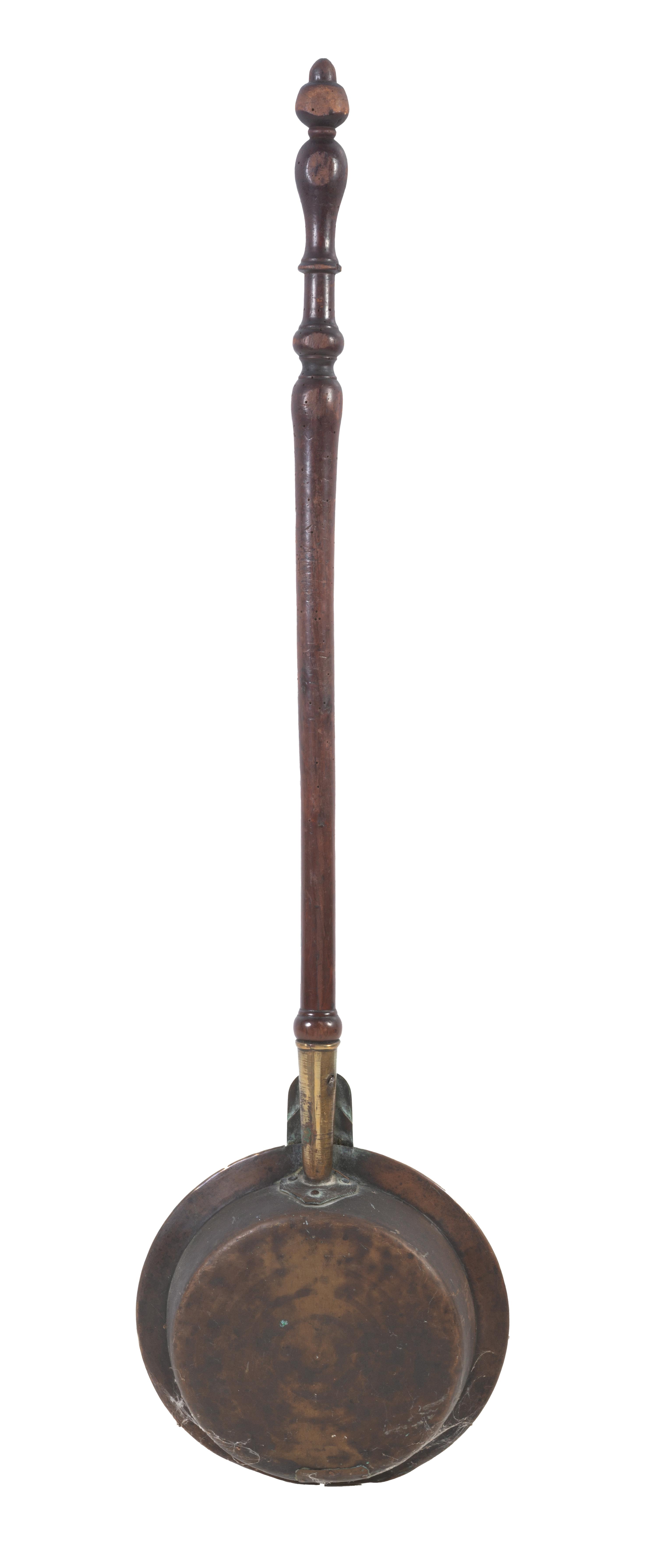 An English Engraved Brass and Turned Walnut Bed Warmer