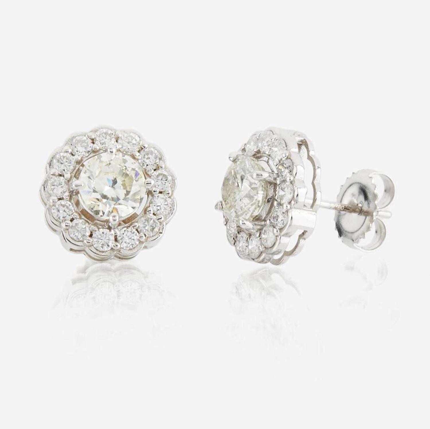 A pair of diamond and white gold earrings