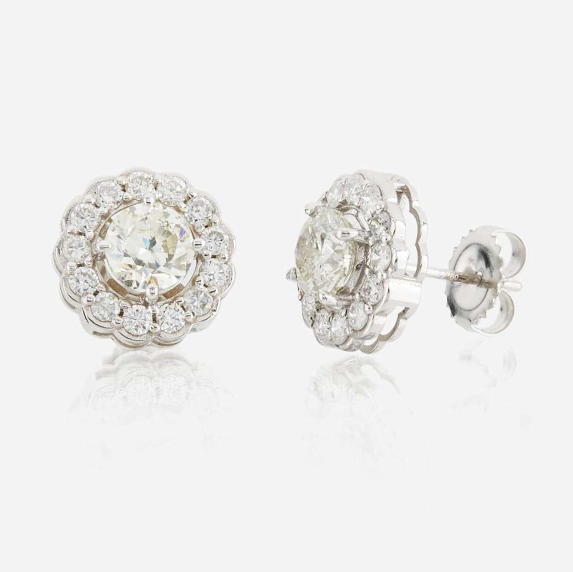 A pair of diamond and white gold earrings