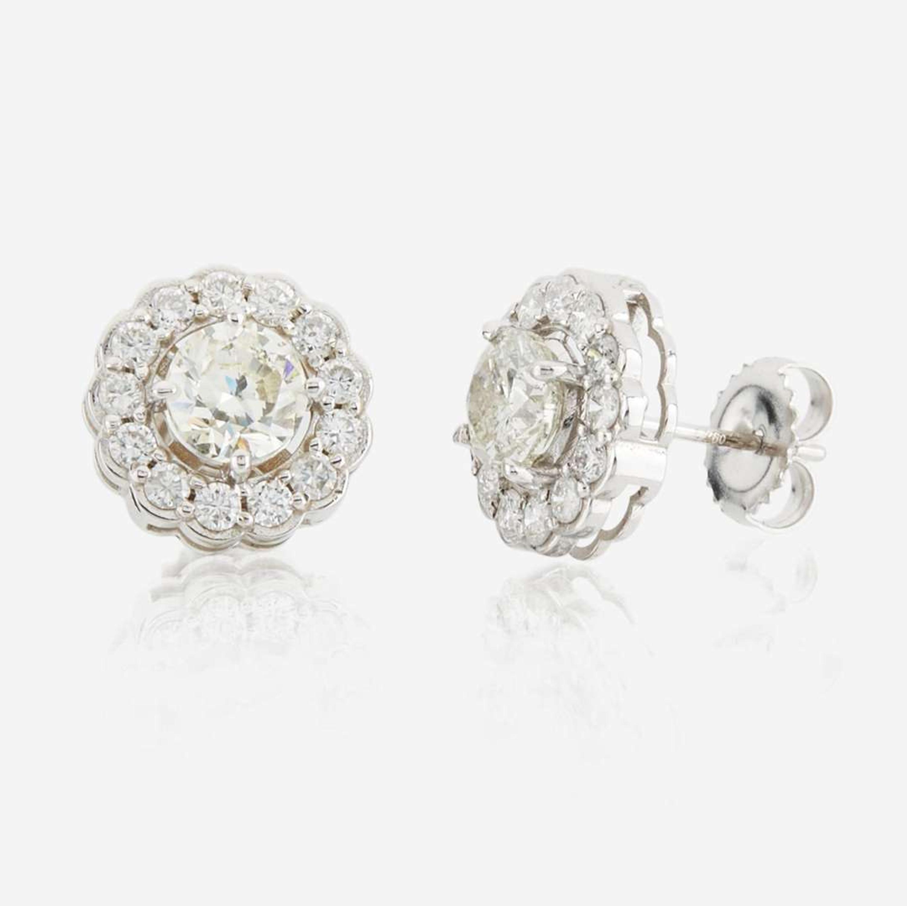 A pair of diamond and white gold earrings