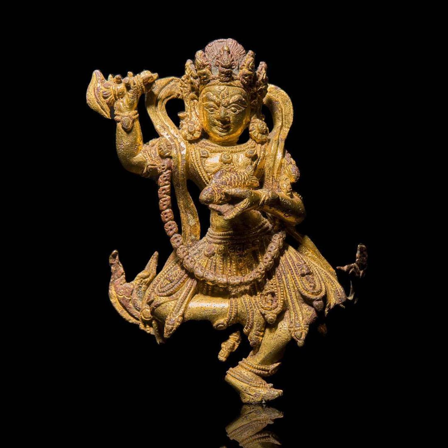A Tibeto-Chinese or Nepalese gilt bronze figure of a wrathful deity 藏傳佛教銅鎏金造像 15th to 17th century ???????