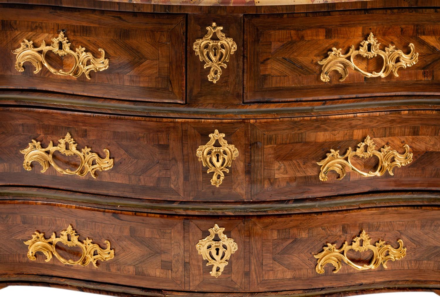 A Régence Gilt Bronze Mounted Tulipwood and Parquetry Marble-Top Commode