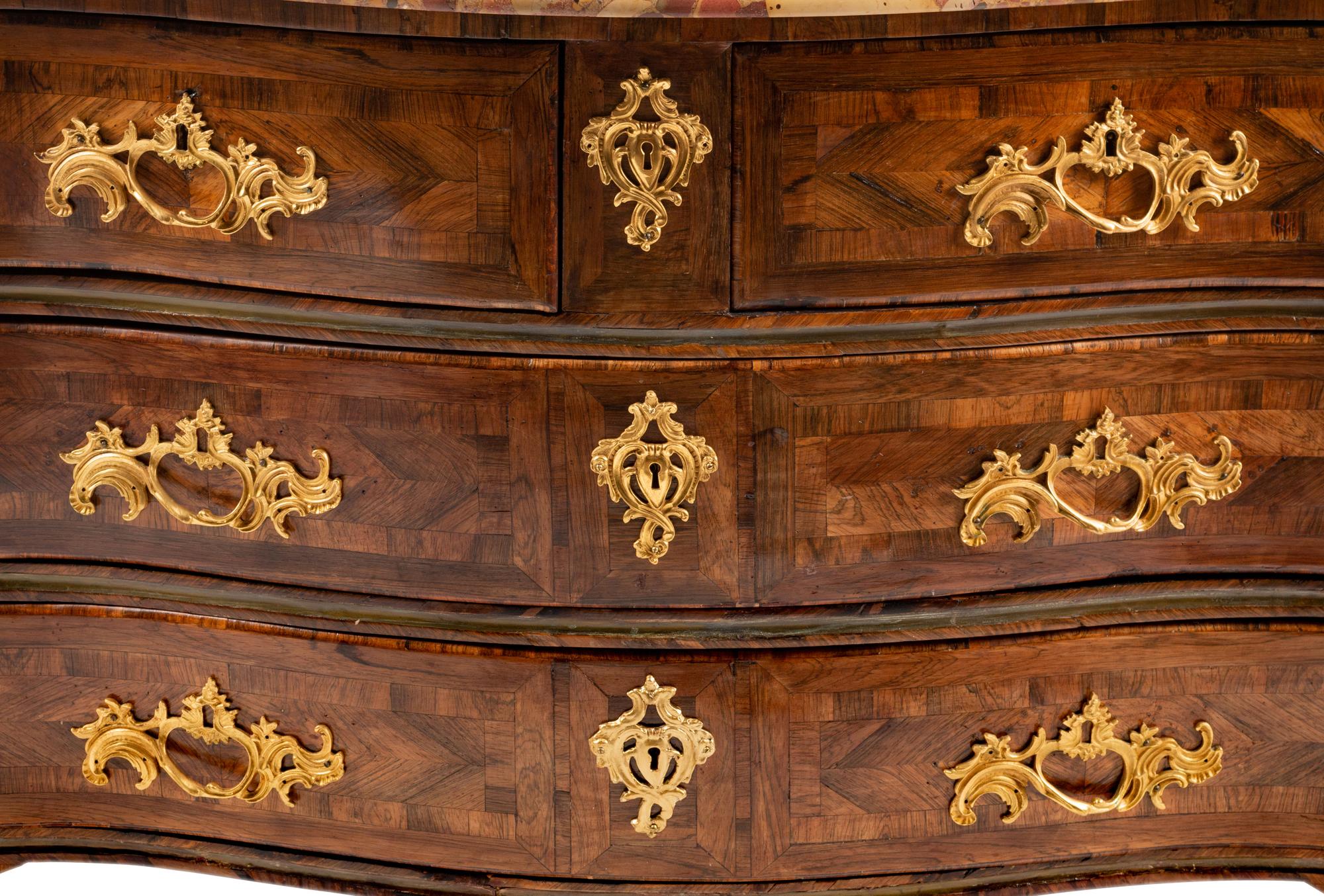 A Régence Gilt Bronze Mounted Tulipwood and Parquetry Marble-Top Commode