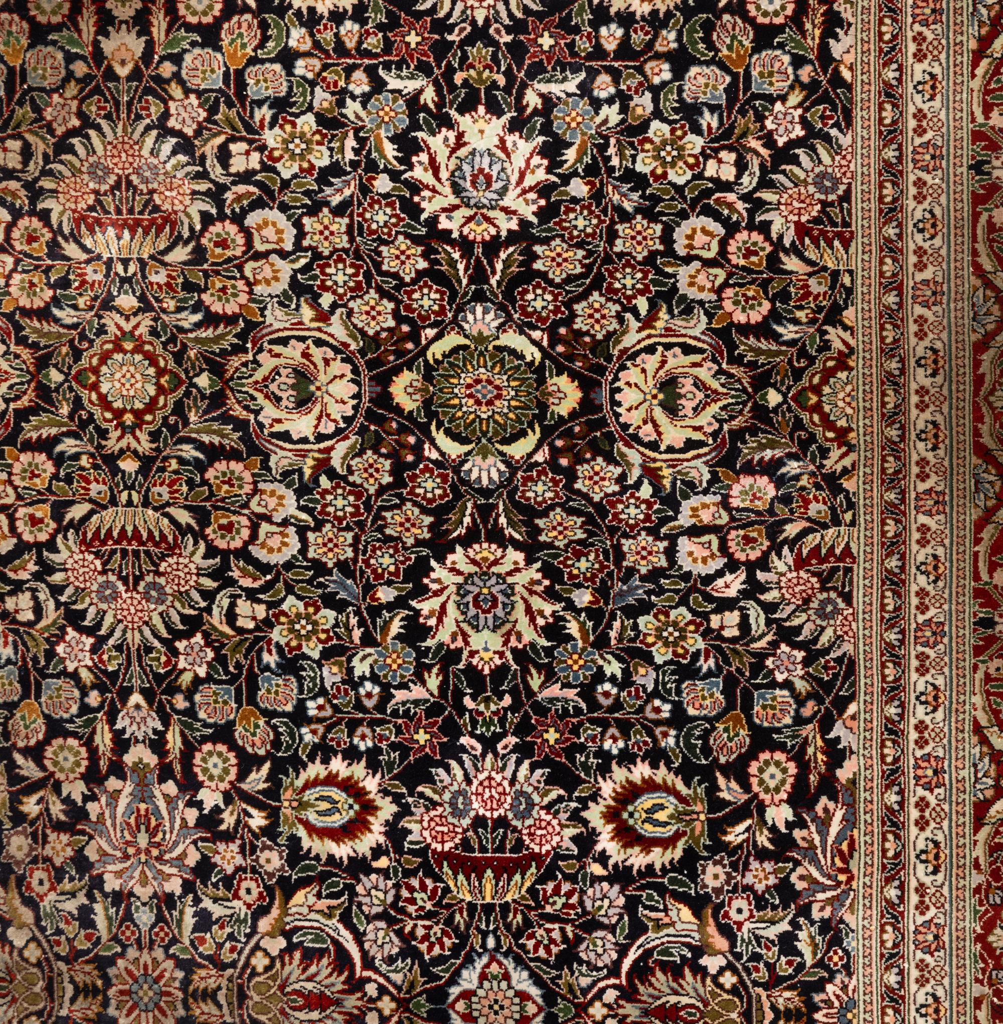 A Silk Tabriz Rug