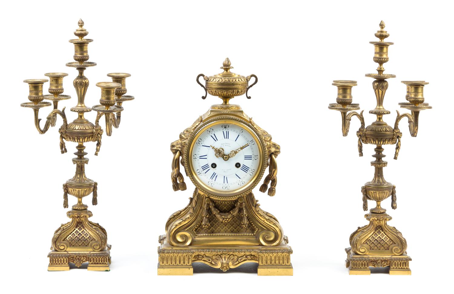 A French Gilt Bronze Clock Garniture Height of candelabra 18 5/8 inches. — 19TH CENTURY