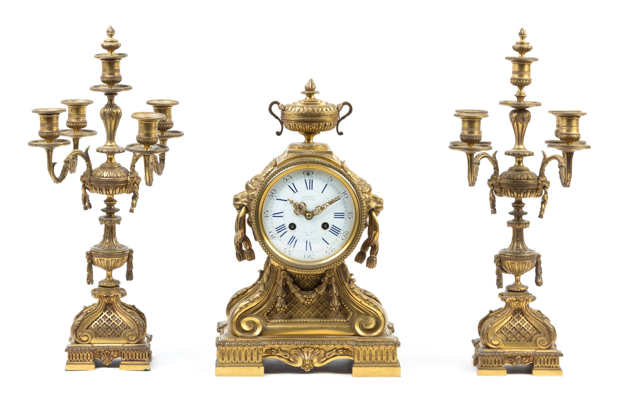 A French Gilt Bronze Clock Garniture Height of candelabra 18 5/8 inches. — 19TH CENTURY