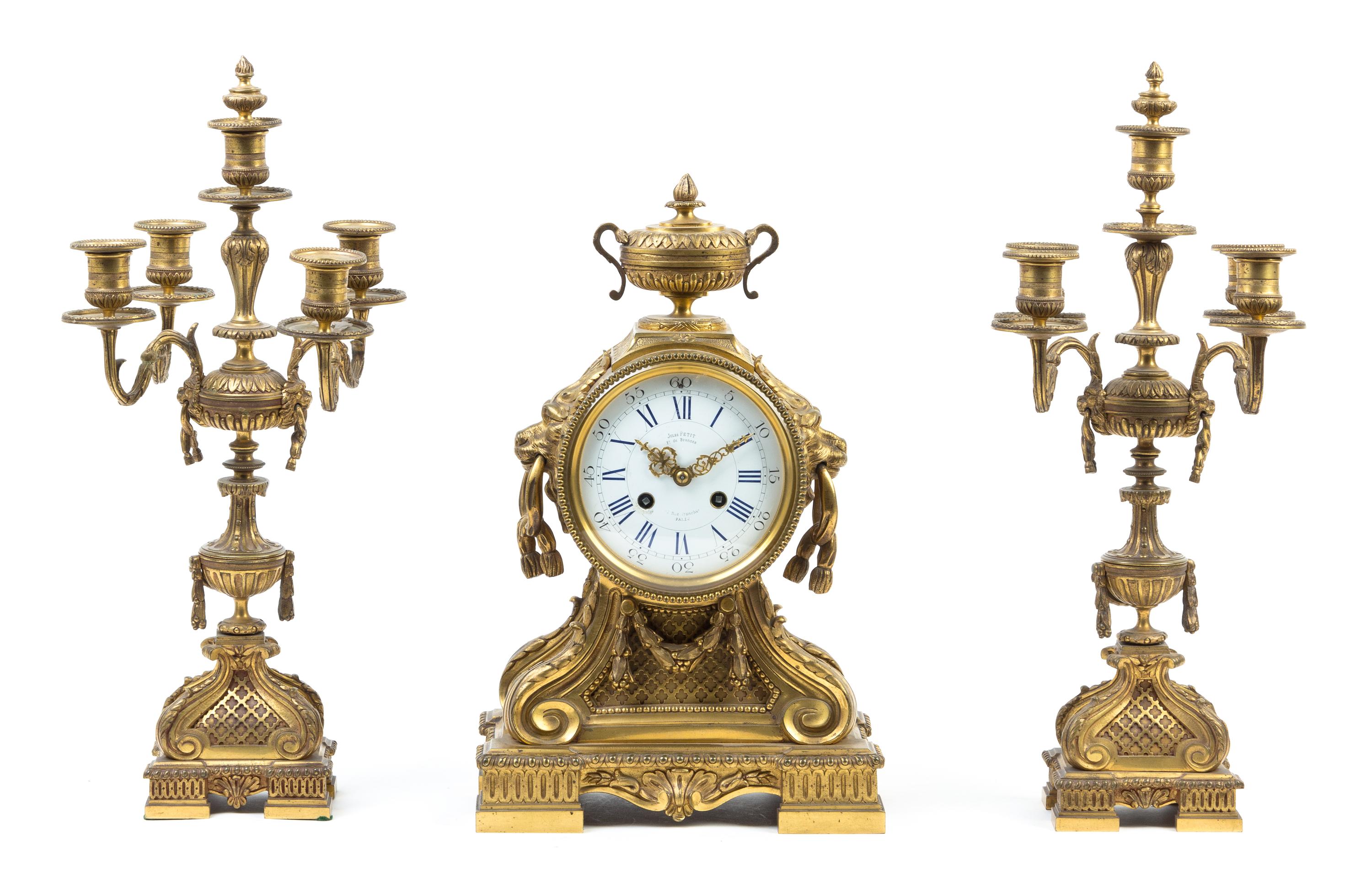 A French Gilt Bronze Clock Garniture Height of candelabra 18 5/8 inches. — 19TH CENTURY