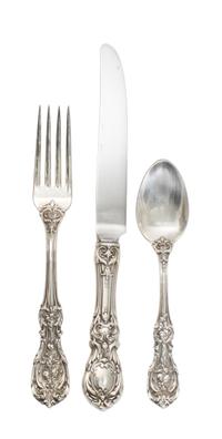 An American Silver Flatware Service, Reed & Barton, Taunton, Mass., comprising: 12 dinner knives 11 dinner forks 12 salad forks 2 table