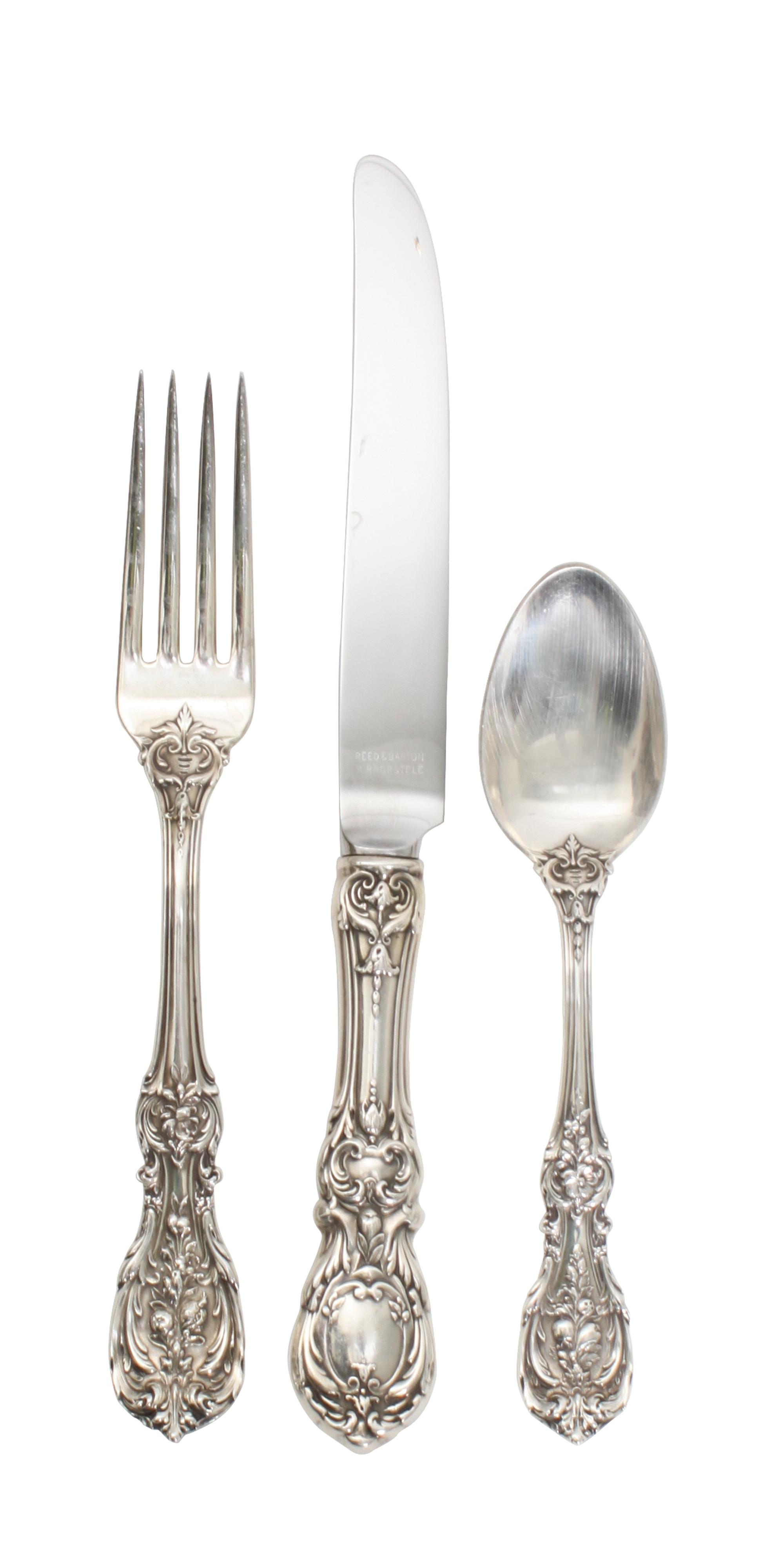An American Silver Flatware Service, Reed & Barton, Taunton, Mass., comprising: 12 dinner knives 11 dinner forks 12 salad forks 2 table