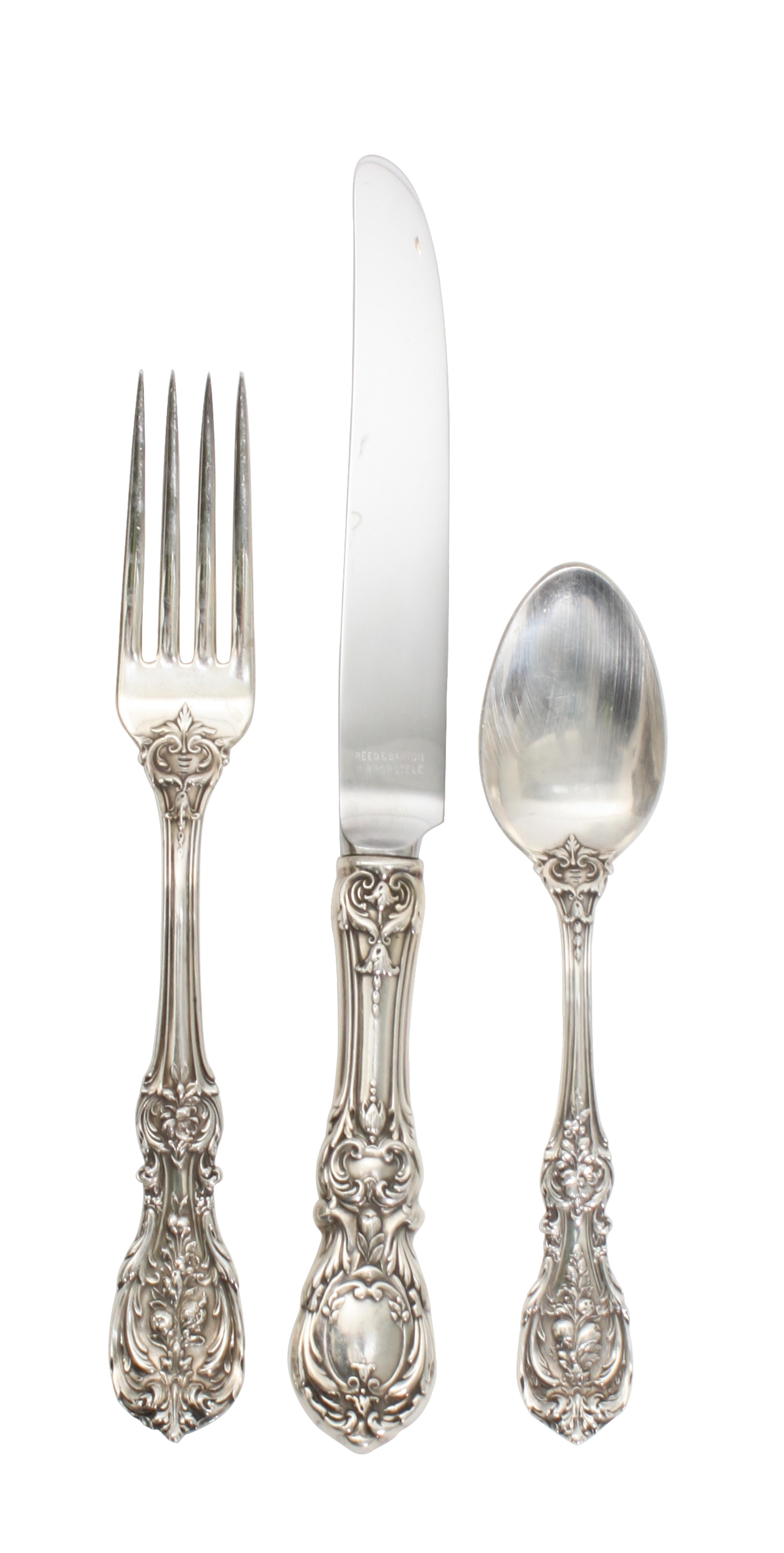 An American Silver Flatware Service, Reed & Barton, Taunton, Mass., comprising: 12 dinner knives 11 dinner forks 12 salad forks 2 table