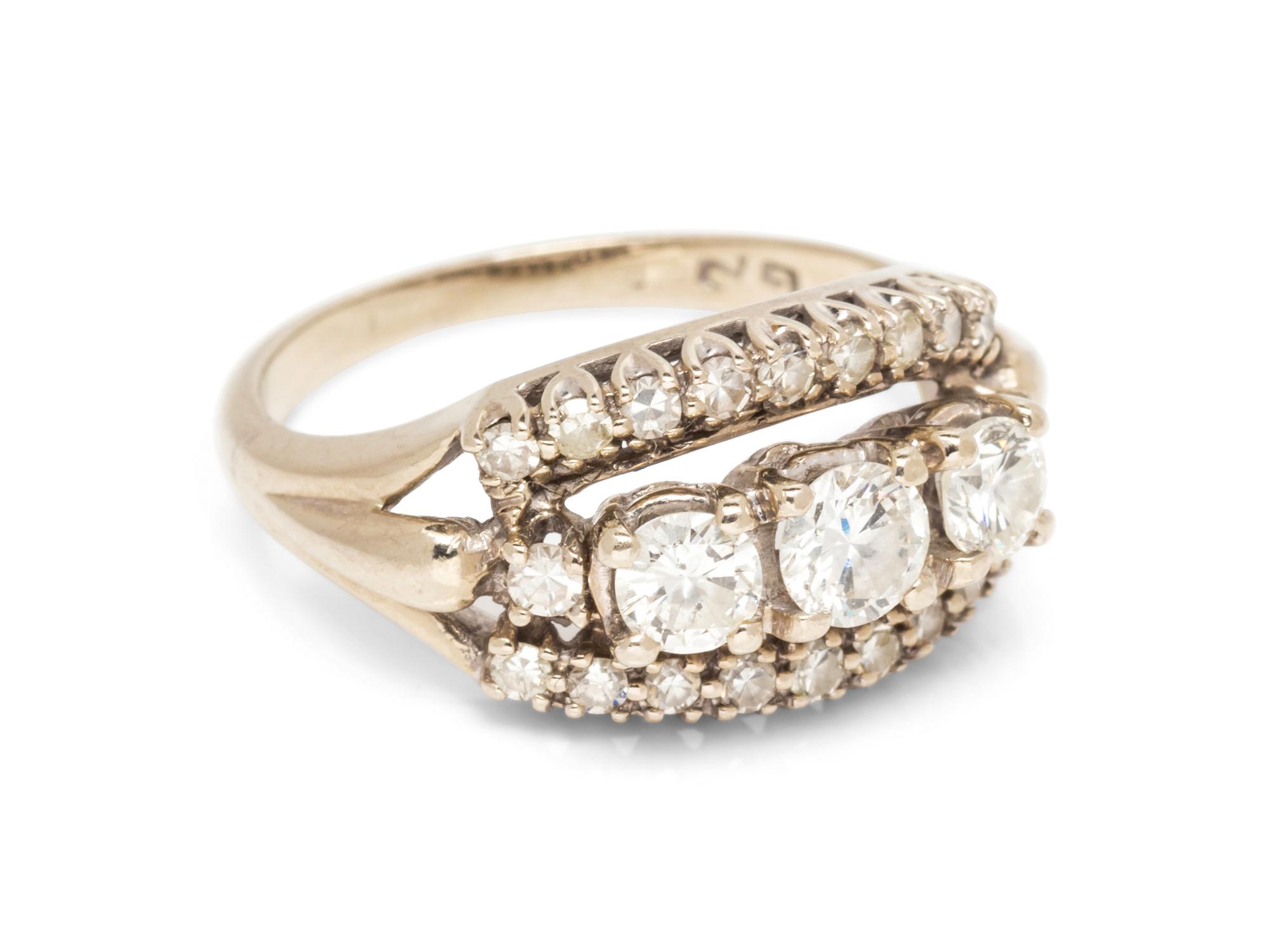 A 14 Karat White Gold and Diamond Ring,