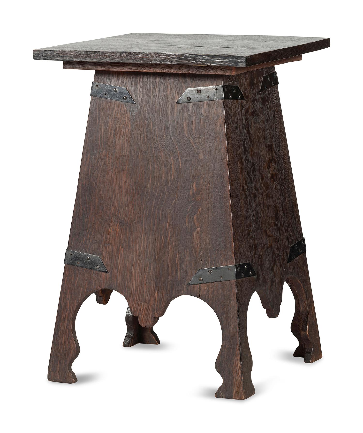 An Arts and Crafts Carved Oak Wine Cellarette