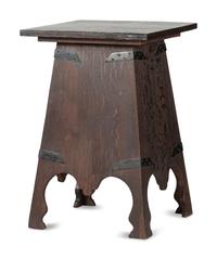 An Arts and Crafts Carved Oak Wine Cellarette
