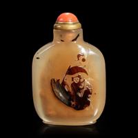 A Chinese carved shadow agate snuff bottle