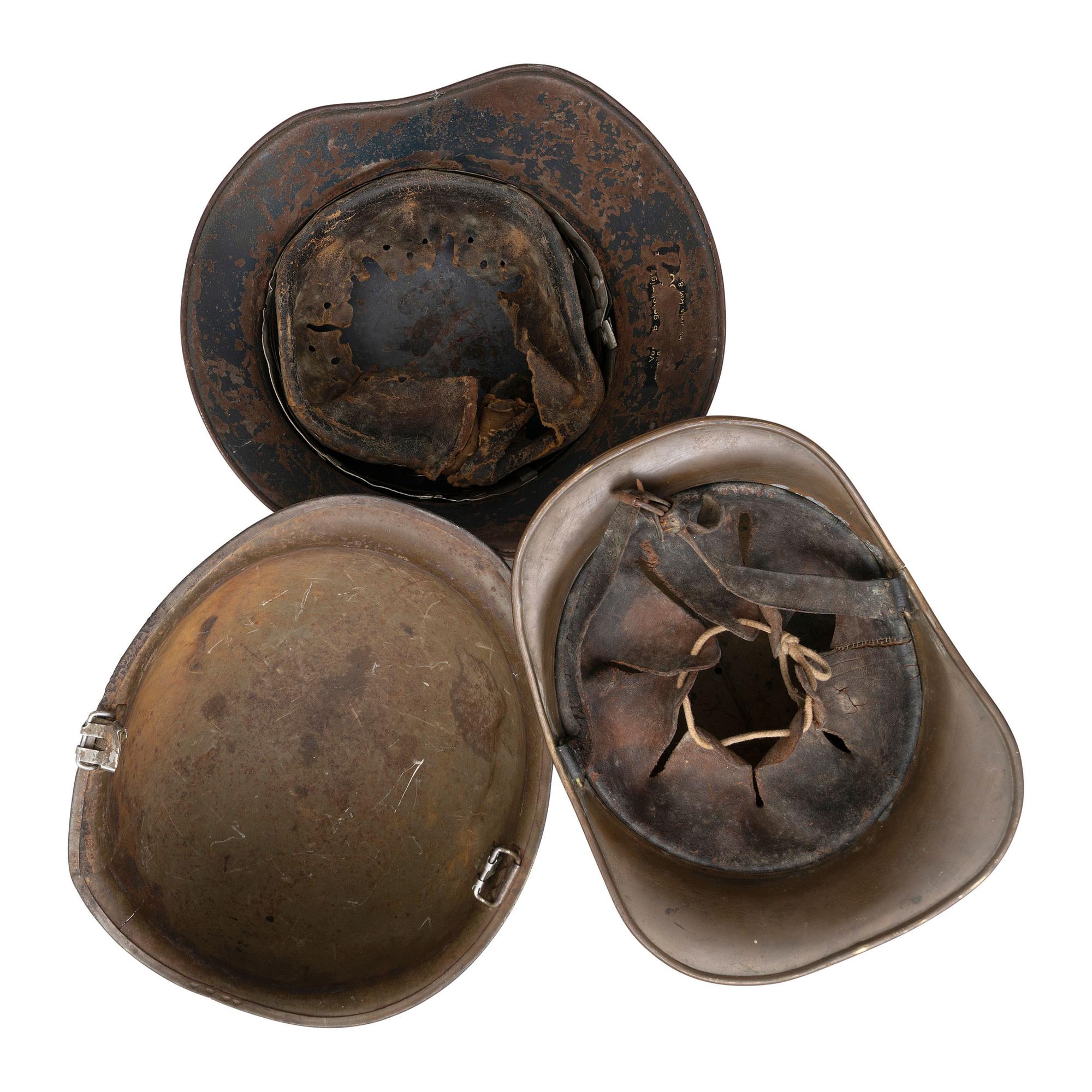 Lot of Three Helmets Including US M1 Shell, and Luftschutz Civil Defense Helmet