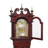 A Colonial Revival Carved Oak Tall Case Clock
