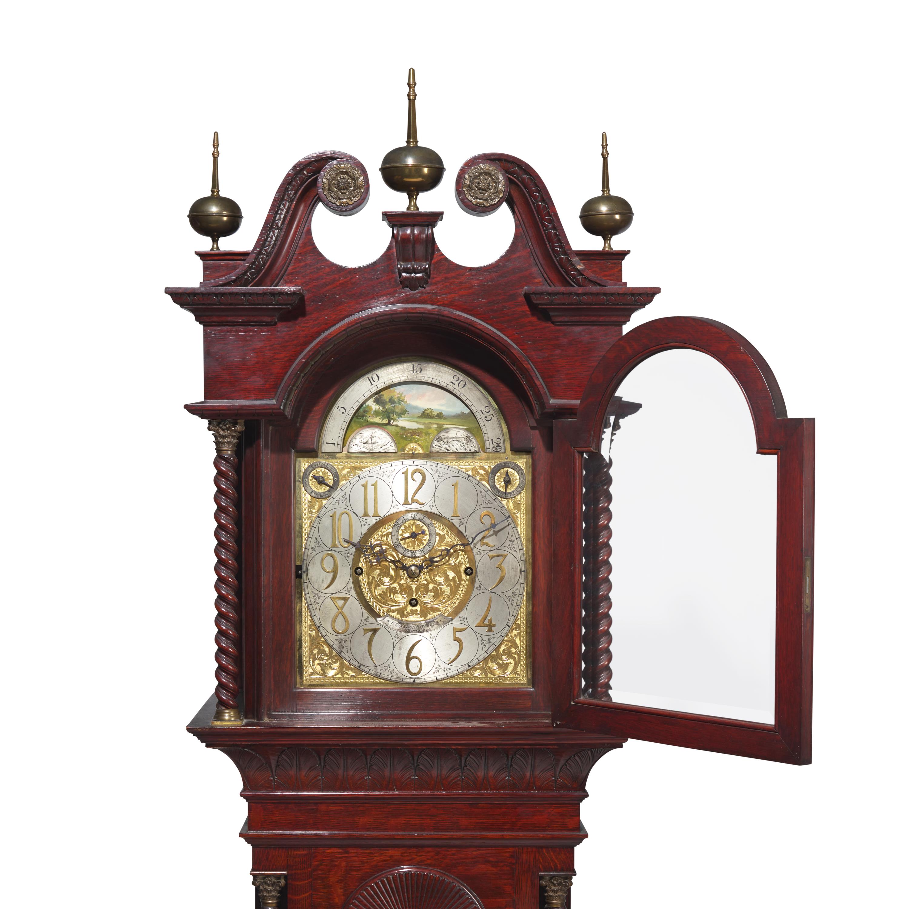 A Colonial Revival Carved Oak Tall Case Clock