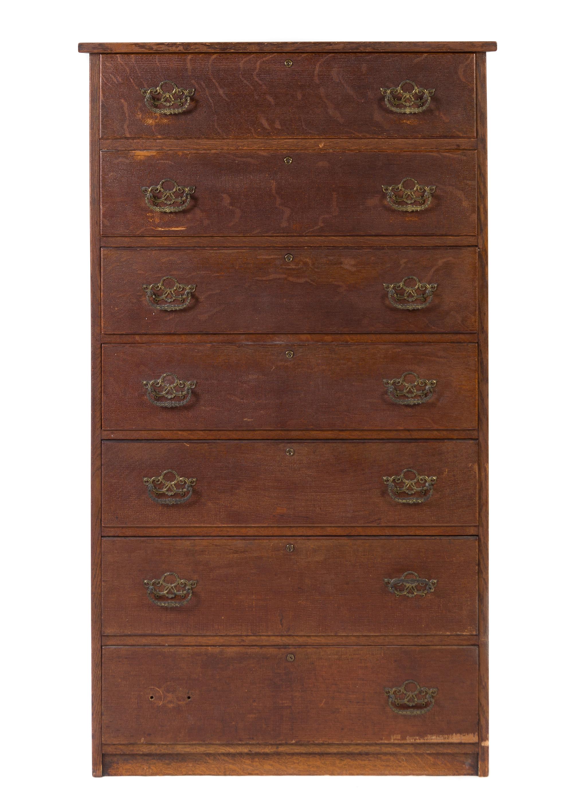 An American Oak Tall Chest of Drawers Height 59 1/2 x width 33 5/8 x depth 18 3/4 inches.