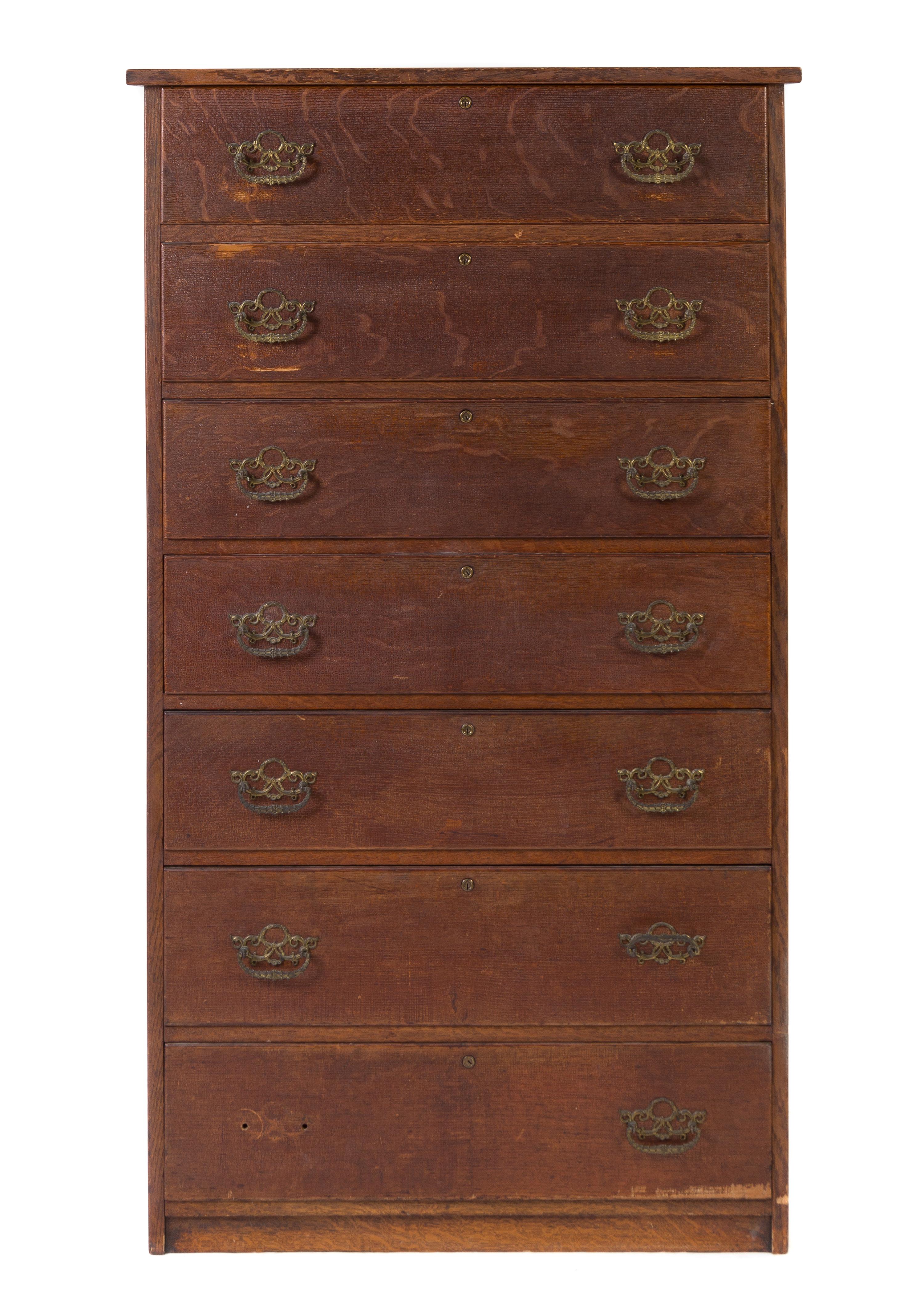 An American Oak Tall Chest of Drawers Height 59 1/2 x width 33 5/8 x depth 18 3/4 inches.