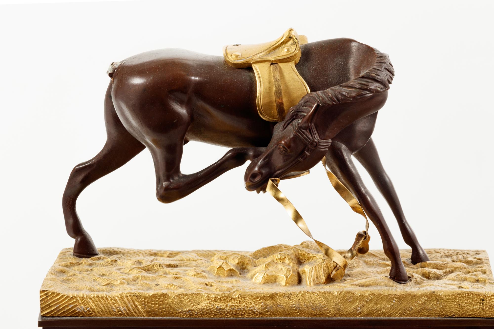 An Empire Style Gilt and Patinated Bronze Mantel Clock