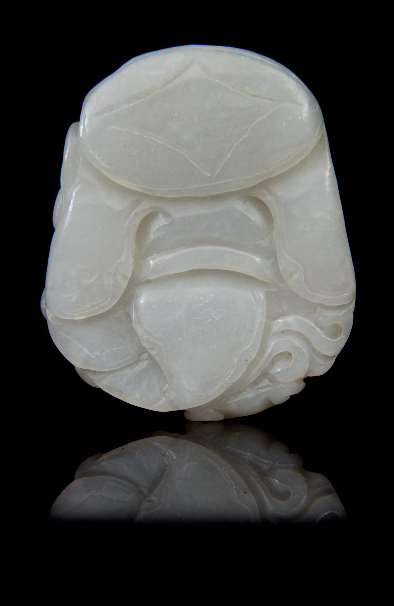 A Carved Jade Toggle Length 2 1/4 inches.