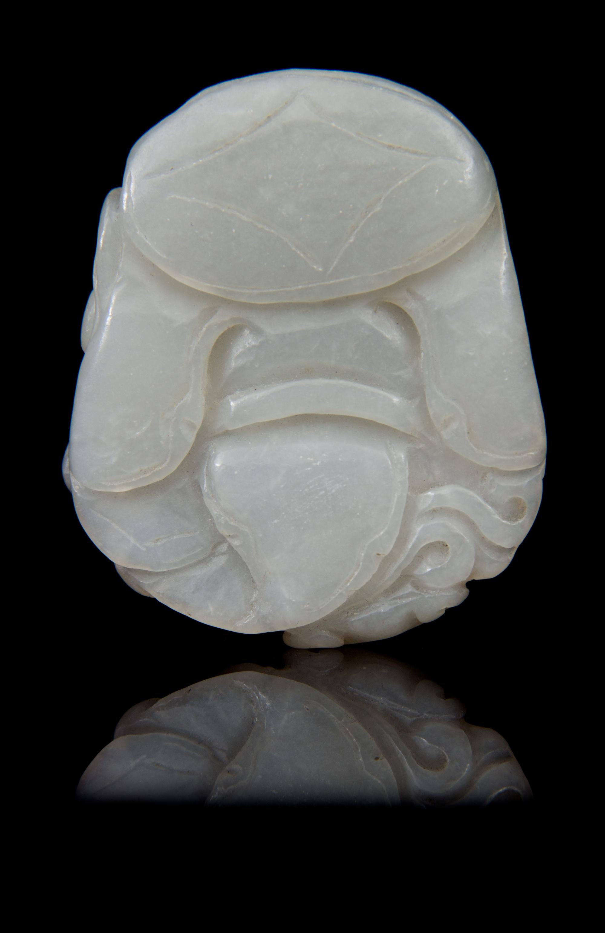 A Carved Jade Toggle Length 2 1/4 inches.