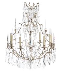 A Silvered Metal Eight-Light Chandelier Diameter 25 1/2 inches. — 20TH CENTURY